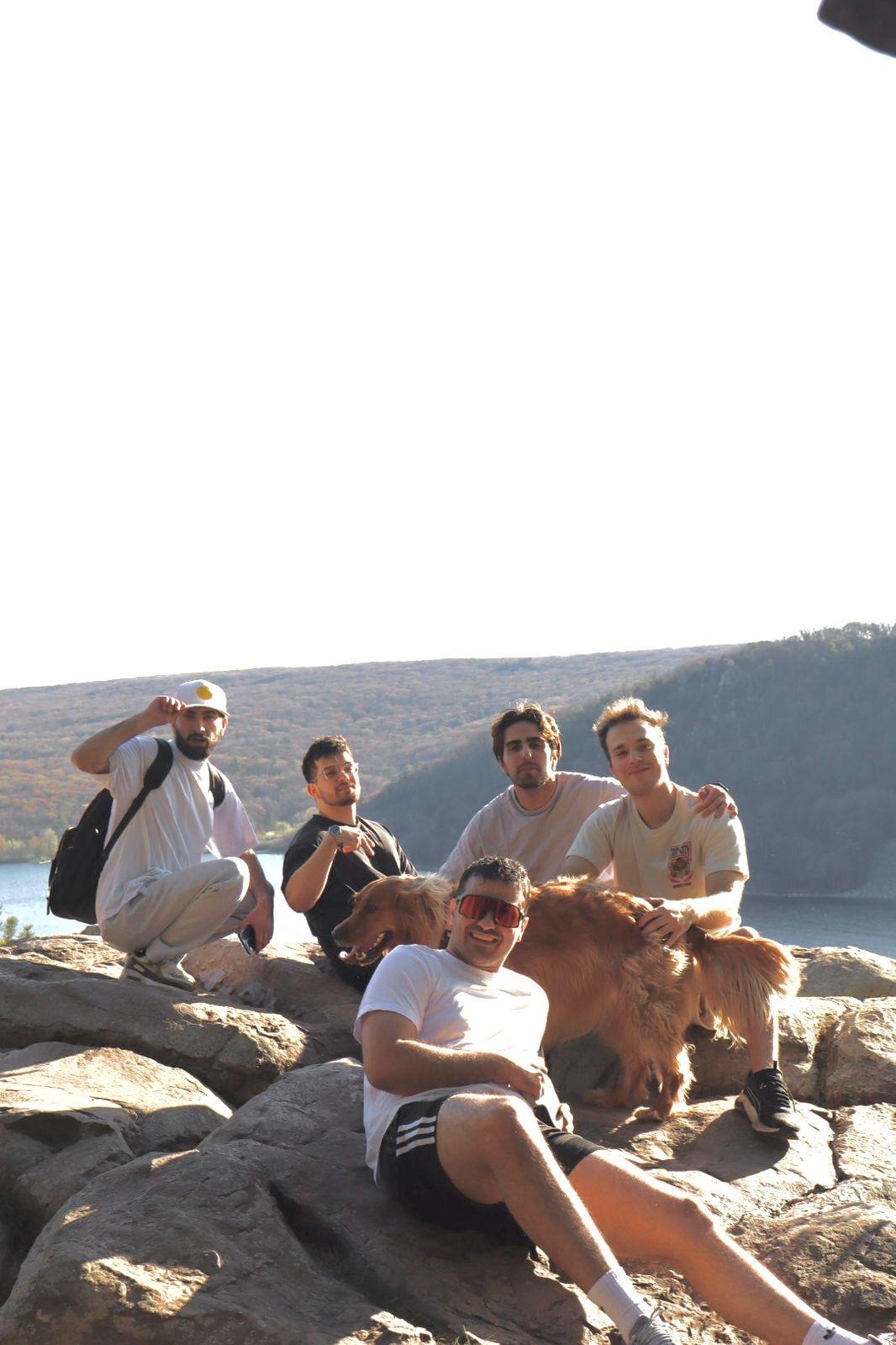 Group of friends sitting on the rocks at Devils Lake